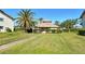 Inviting clubhouse surrounded by lush landscaping, offering a welcoming community gathering place at 1783 Lake Pl # 1783C, Venice, FL 34293