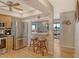Bright kitchen with stainless steel appliances and a breakfast bar overlooking the dining area at 1783 Lake Pl # 1783C, Venice, FL 34293
