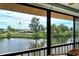 Enjoy serene water views from the comfort of this screened-in lanai at 1783 Lake Pl # 1783C, Venice, FL 34293