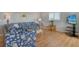 Bright living room featuring stylish coastal-themed decor and wood flooring at 1783 Lake Pl # 1783C, Venice, FL 34293