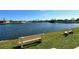 Benches line the water edge, providing tranquil spots for residents to enjoy the waterfront at 1783 Lake Pl # 1783C, Venice, FL 34293