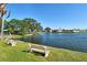 Relax on park benches with a picturesque waterfront view of the community at 1783 Lake Pl # 1783C, Venice, FL 34293