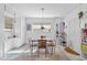 Bright dining area with a wooden table, four chairs, and unique decor at 1909 28Th W St, Bradenton, FL 34205