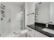 Modern bathroom featuring a sleek, glass-enclosed shower and black hardware at 19912 Bridgetown Loop, Venice, FL 34293