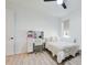Bright bedroom features a vanity desk, a comfortable bed, and white walls at 19912 Bridgetown Loop, Venice, FL 34293