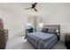 Bedroom with a comfortable bed and a desk by the window at 19912 Bridgetown Loop, Venice, FL 34293