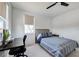 Bedroom featuring a window-side desk, natural light, and carpeted floors at 19912 Bridgetown Loop, Venice, FL 34293