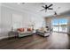 Bright clubhouse living room with neutral sofas and sliding glass doors to pool at 19912 Bridgetown Loop, Venice, FL 34293