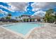 Large community pool with clubhouse in the background on a sunny day at 19912 Bridgetown Loop, Venice, FL 34293