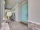 Charming front porch with stylish seating and a welcoming, brightly colored front door at 19912 Bridgetown Loop, Venice, FL 34293