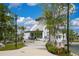 Community center set among lush landscaping with walking path and beautiful pond in the background at 19912 Bridgetown Loop, Venice, FL 34293