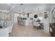 Modern kitchen with a center island, stainless steel appliances, and an adjacent dining area at 19912 Bridgetown Loop, Venice, FL 34293