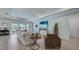 Bright living room featuring an open layout, wood flooring, and view to the lanai at 19912 Bridgetown Loop, Venice, FL 34293
