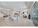Spacious open-concept living area with a modern kitchen and a view of the backyard at 19912 Bridgetown Loop, Venice, FL 34293