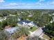 Aerial view of the home surrounded by a lush tree canopy and neighborhood at 2177 Sunnyside Pl, Sarasota, FL 34239