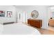 Spacious bedroom with hardwood floors, modern furniture, and natural light at 2177 Sunnyside Pl, Sarasota, FL 34239