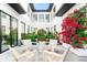 Captivating courtyard with upscale furniture and greenery, creating a serene and inviting atmosphere at 2177 Sunnyside Pl, Sarasota, FL 34239