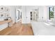 Bright main bedroom with ensuite bath, wood floors, and natural light at 2177 Sunnyside Pl, Sarasota, FL 34239