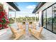 Beautiful outdoor patio with modern seating and colorful flowers at 2177 Sunnyside Pl, Sarasota, FL 34239