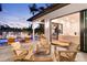 Inviting patio with outdoor seating, pool views, and seamless indoor-outdoor living at 2177 Sunnyside Pl, Sarasota, FL 34239