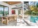Relax and dine al fresco on the patio, complete with dining area, sun loungers, and access to the refreshing pool at 2177 Sunnyside Pl, Sarasota, FL 34239