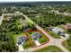 Wide aerial view of two homes showcasing their layout, landscaping, and location within a residential area at 2375 Saybrook Ave, North Port, FL 34286