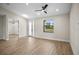 Bright bedroom featuring a ceiling fan, and natural light through the window at 2375 Saybrook Ave, North Port, FL 34286