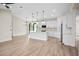 Modern, open-concept kitchen with a large island, stainless steel appliances, and sleek white cabinetry at 2375 Saybrook Ave, North Port, FL 34286