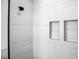 Sleek walk-in shower with custom shelving and light-colored tile walls at 2375 Saybrook Ave, North Port, FL 34286