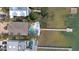 Aerial view of a waterfront property with a pool, dock, and inviting outdoor spaces perfect for entertaining at 2407 Avenue A, Bradenton Beach, FL 34217