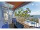 Balcony with ocean views, seating, and a unique spiral staircase at 2407 Avenue A, Bradenton Beach, FL 34217