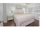 Bedroom with a large bed, neutral colors, and natural light at 2407 Avenue A, Bradenton Beach, FL 34217