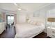 Serene bedroom features a king bed, private balcony access with stunning water views, and ensuite bathroom at 2407 Avenue A, Bradenton Beach, FL 34217