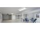 Expansive garage with epoxy floors, bright lighting, and ample space for parking and recreational activities at 2407 Avenue A, Bradenton Beach, FL 34217