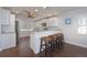 Charming kitchen featuring a breakfast bar with seating and modern stainless steel appliances at 2407 Avenue A, Bradenton Beach, FL 34217