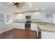 Bright kitchen with stainless appliances, granite countertops, and custom white cabinetry at 2407 Avenue A, Bradenton Beach, FL 34217