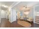 Inviting living room area with neutral tones, stylish seating, and convenient access to nearby rooms and amenities at 2407 Avenue A, Bradenton Beach, FL 34217