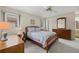 Cozy bedroom with a full-sized bed, desk, and plenty of natural light at 2913 Captiva Gardens Dr # 2, Sarasota, FL 34231