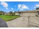 Charming single-story homes with attached garages and well-manicured lawns, showcasing curb appeal at 2913 Captiva Gardens Dr # 2, Sarasota, FL 34231