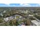 Expansive aerial view of a residential area with lush trees surrounding homes at 3266 Lanai Ave, North Port, FL 34288