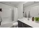Bright bathroom featuring a shower and bathtub combination and a single sink vanity at 3266 Lanai Ave, North Port, FL 34288