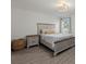 Comfortable bedroom featuring a modern light fixture and a wooden nightstand and bedframe at 3266 Lanai Ave, North Port, FL 34288