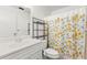 Bathroom with a white vanity, toilet, and shower featuring a cheerful lemon-themed curtain at 3758 59Th W Ave # 4099, Bradenton, FL 34210
