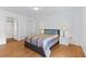 Bright bedroom with hardwood floors, closet, and an ensuite bathroom at 3758 59Th W Ave # 4099, Bradenton, FL 34210