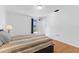 Bedroom with hardwood floors, and a large window offering natural light at 3758 59Th W Ave # 4099, Bradenton, FL 34210