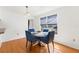 Dining area with a round table, four chairs, and natural light from a nearby window at 3758 59Th W Ave # 4099, Bradenton, FL 34210