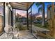 Enclosed patio featuring tile flooring with a sunset view and comfortable outdoor seating at 3758 59Th W Ave # 4099, Bradenton, FL 34210