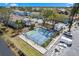 Overhead shot of a community tennis court and clubhouse with ample parking at 3758 59Th W Ave # 4099, Bradenton, FL 34210