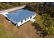 A high-definition aerial shot showcases the backyard and landscaping of this single-story home at 3807 Las Vegas Ave, North Port, FL 34288
