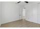 Bright bedroom featuring tile floors, ceiling fan, and ensuite bathroom access at 3807 Las Vegas Ave, North Port, FL 34288